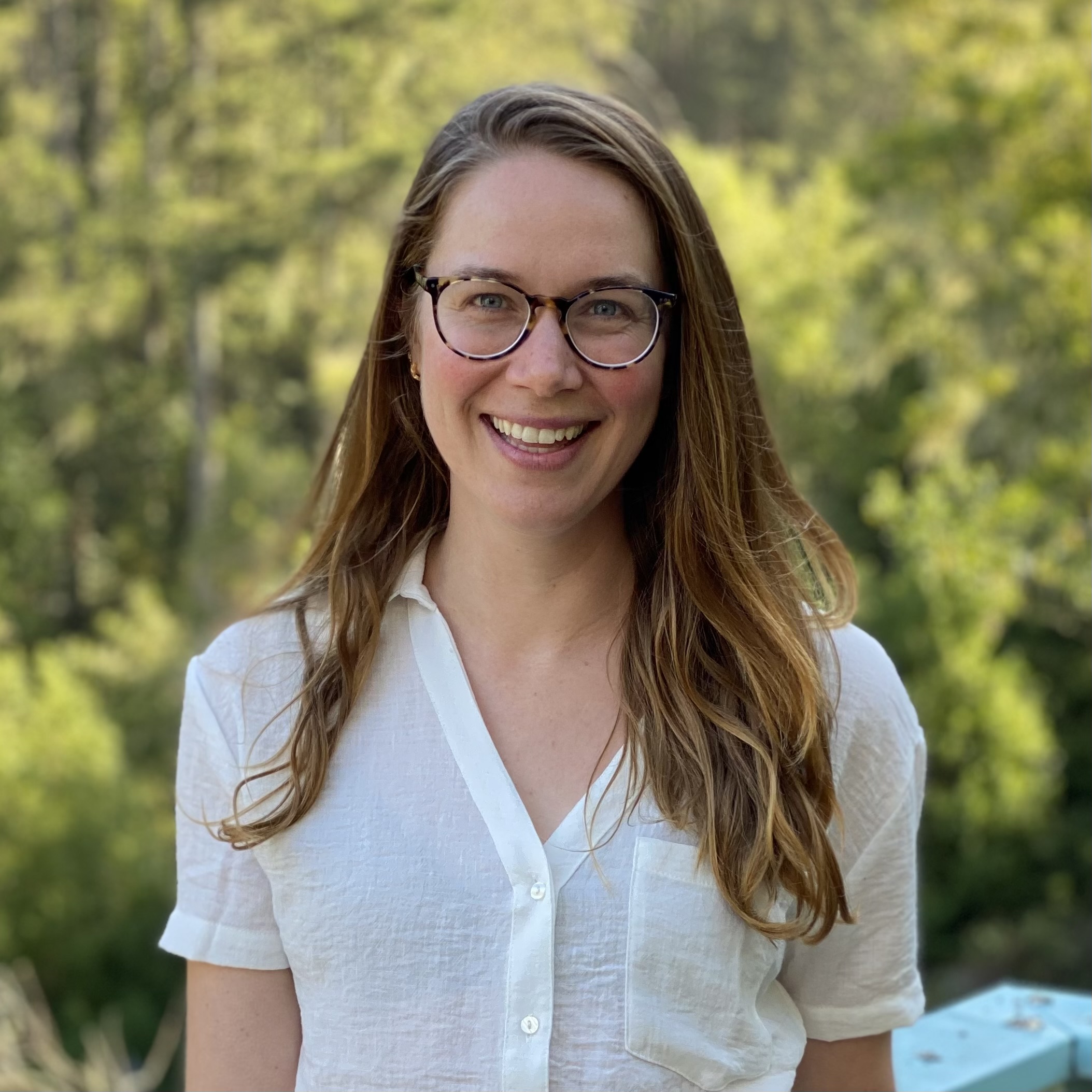 Claire smiling outdoors